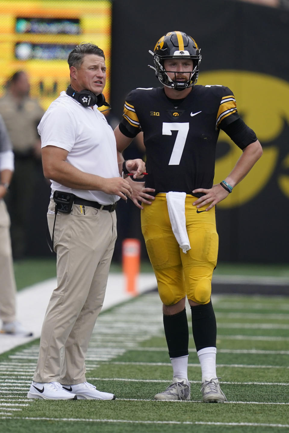 Iowa offensive coordinator Brian Ferentz talks with quarterback Spencer Petras (7) during the second half of an NCAA college football game against South Dakota State, Saturday, Sept. 3, 2022, in Iowa City, Iowa. Iowa won 7-3. (AP Photo/Charlie Neibergall)