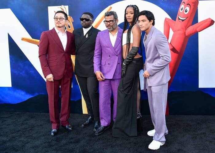 the cast with Jordan Peele at an event