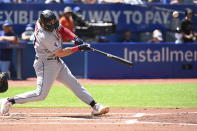 Cleveland Guardian' Austin Hedges hits an RBI double, scoring Tyler Freeman in the second inning of a baseball game against the Toronto Blue Jays in Toronto, Sunday, Aug. 14, 2022. (Jon Blacker/The Canadian Press via AP)