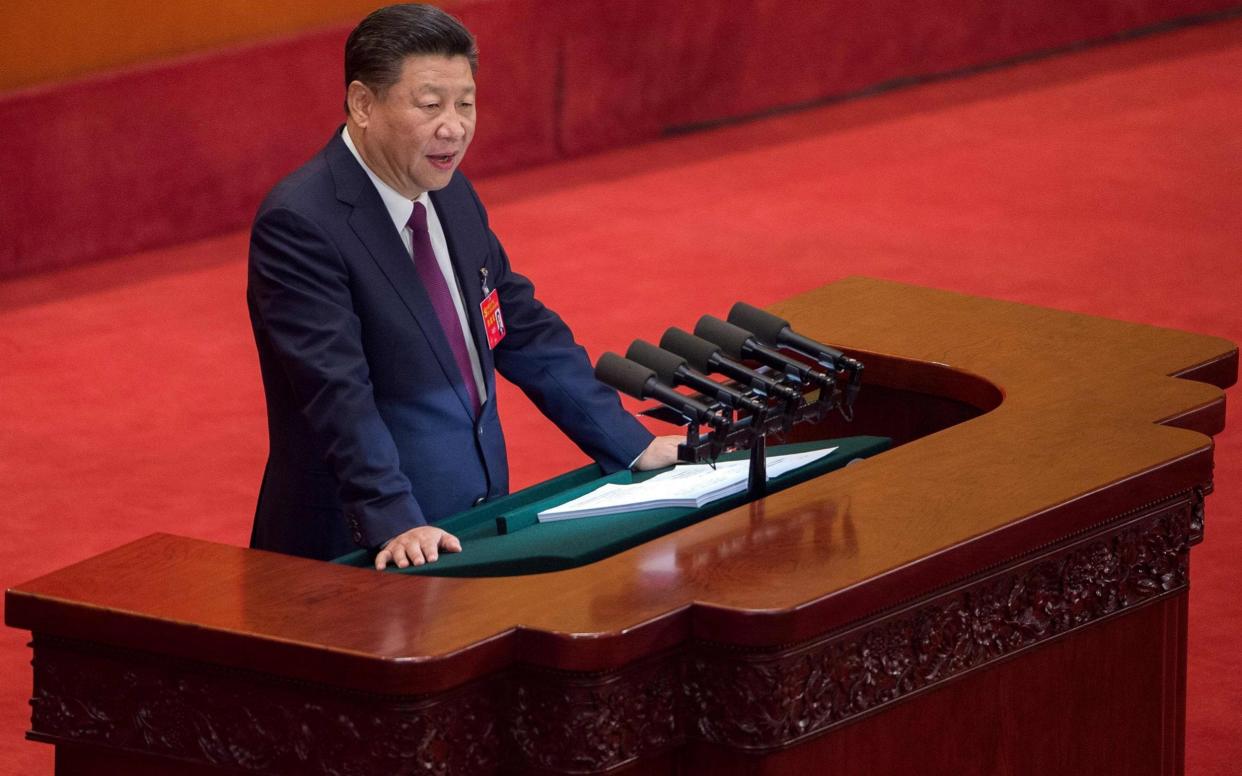 Xi Jinping delivers his opening speech at the Party Congress - AFP