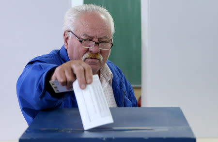 A man votes during a referendum on "Statehood Day" in Laktasi near Banja Luka, Bosnia and Herzegovina, September 25, 2016. REUTERS/Dado Ruvic