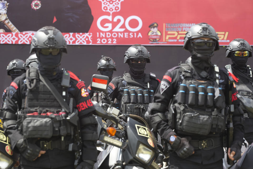 FILE - Police force line up during a security parade in preparation for the upcoming the G20 meeting in Bali, Indonesia on Nov. 7, 2022. Chinese leader Xi Jinping is leaving his country's COVID bubble and venturing abroad next week into a dramatically changed world marked by rising confrontation. Xi will attend the G-20 meeting of industrial and emerging market nations in Indonesia followed by the Asia-Pacific Economic Cooperation summit in Thailand. (AP Photo/Firdia Lisnawati, File)