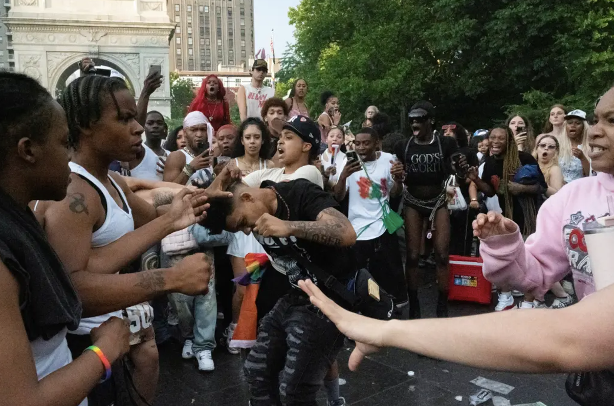 Revelers fight each other during Pride in Washington Square Park in New York City on June 30, 2024 (Reuters)