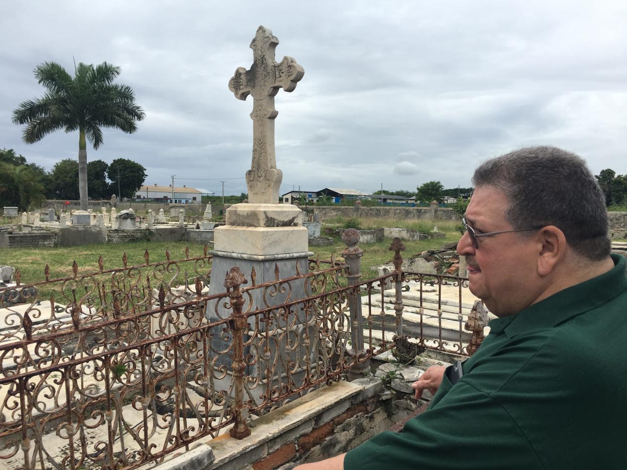 My dad, Ed Delfin, looks out at Cementerio la Reina in Cienfuegos. Family members are buried here. The hauntingly beautiful cemetery is weathered by time, floods and more.