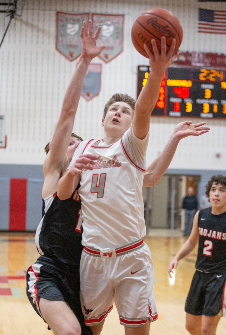 Sandy Valley's Jordan Wigfield goes to the hoop with pressure from Tusky Valley's Beau Wolf in the first half at Sandy Valley , Tuesday, Feb. 7, 2023.