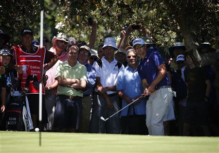 Australia's Adam Scott hits a chip shot on the 8th hole during the first round of the Australian Open golf tournament at Royal Sydney Golf Club November 28, 2013. U.S. Masters champion Scott confirmed his remarkable form by carding a course record 10-under-par 62 in the first round of the Australian Open on Thursday. REUTERS/David Gray