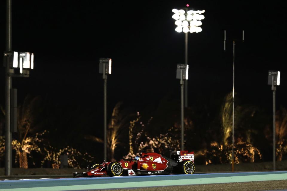 Ferrari driver Fernando Alonso of Spain steers his car during the second free practice ahead of the Bahrain Formula One Grand Prix at the Formula One Bahrain International Circuit in Sakhir, Bahrain, Friday, April 4, 2014. (AP Photo/Hassan Ammar)