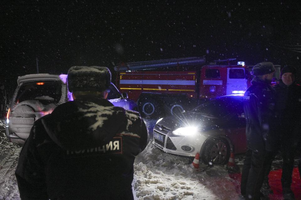 <p>Police block the road to the scene of a AN-148 plane crash in Stepanovskoye village, about 40 kilometers (25 miles) from the Domodedovo airport, Russia, Feb. 11, 2018. (Photo: Nikolay Koreshkov/AP) </p>