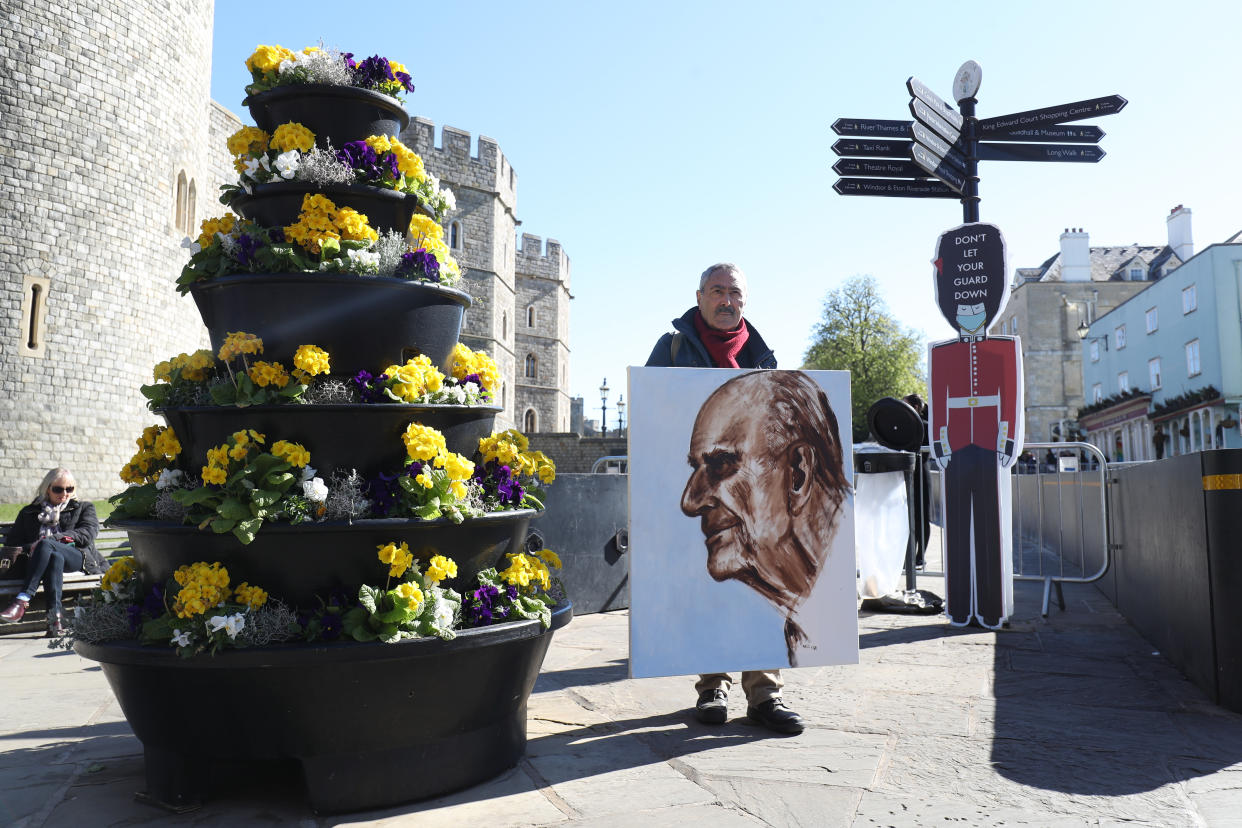 Artist Kaya Mar with a portrait of the Duke of Edinburgh, outside Windsor Castle, on the morning of the funeral of the Duke of Edinburgh taking place in St George's Chapel, at Windsor Castle, Berkshire, this afternoon. Picture date: Saturday April 17, 2021. (Photo by Andrew Matthews/PA Images via Getty Images)