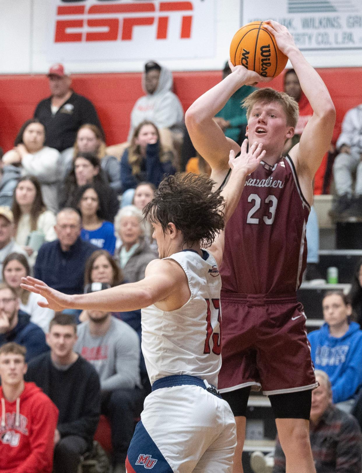 Walsh's Zack Oddo shoots a 3-pointer during a game against Malone in January.