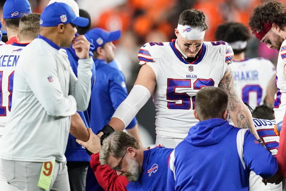 Buffalo Bills players and staff pray for Damar Hamlin.