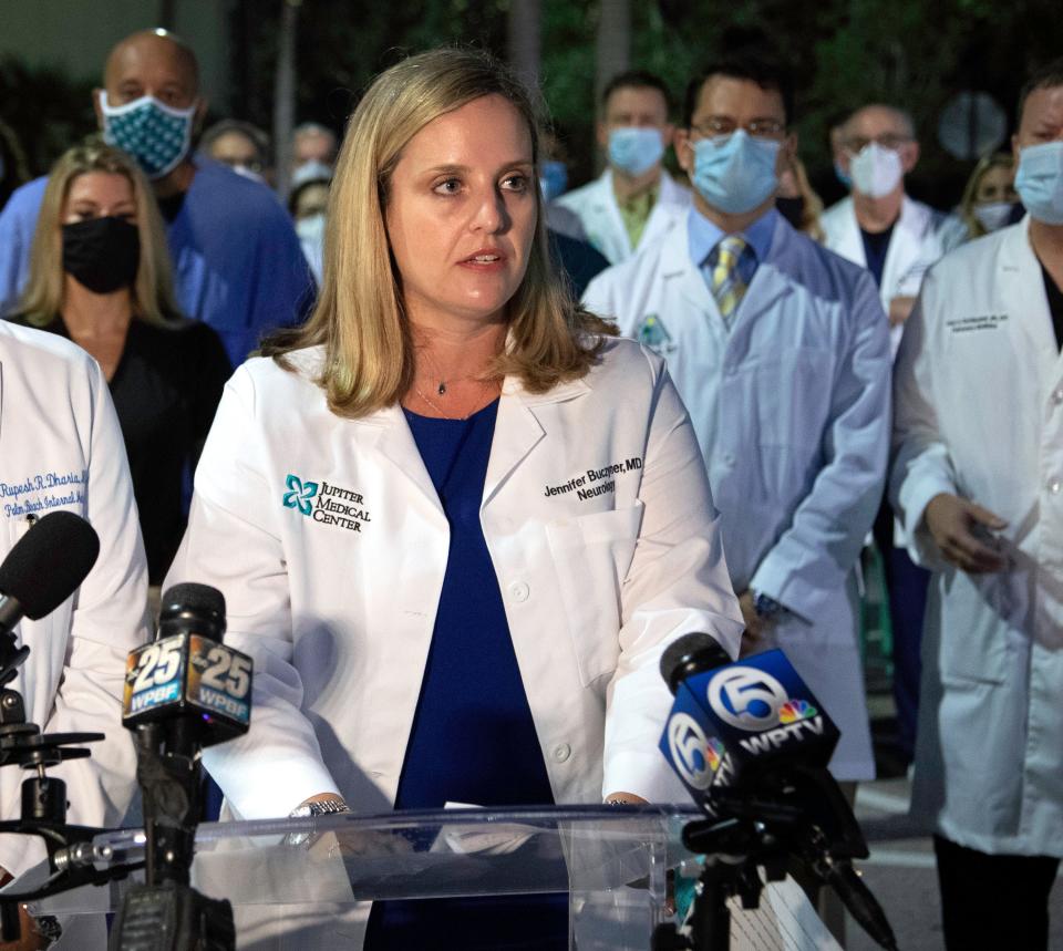 Dr. Jennifer Buczyner of Jupiter Medical Center speaks as a group of physicians and administrators gathered in Palm Beach Gardens early Monday morning, August 23, 2021 to support vaccinations and the wearing of masks in their fight against COVID-19.  The entire physician staff of Palm Beach Gardens Medical Center was invited, as well as doctors from other area hospitals. 