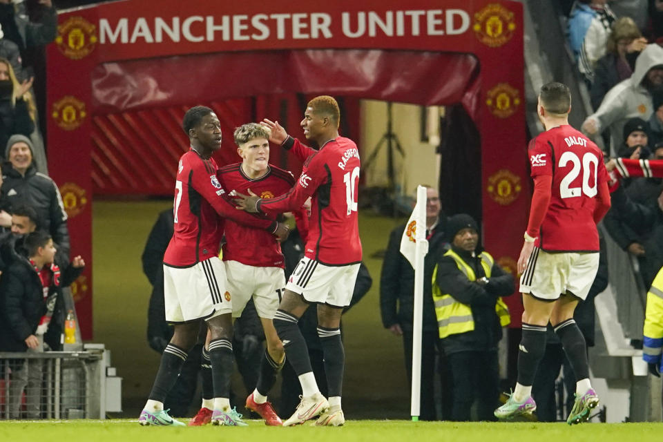 Manchester United's Alejandro Garnacho, second left, celebrates after scoring his side's second goal during the English Premier League soccer match between Manchester United and Aston Villa at the Old Trafford stadium in Manchester, England, Tuesday, Dec. 26, 2023. (AP Photo/Dave Thompson)