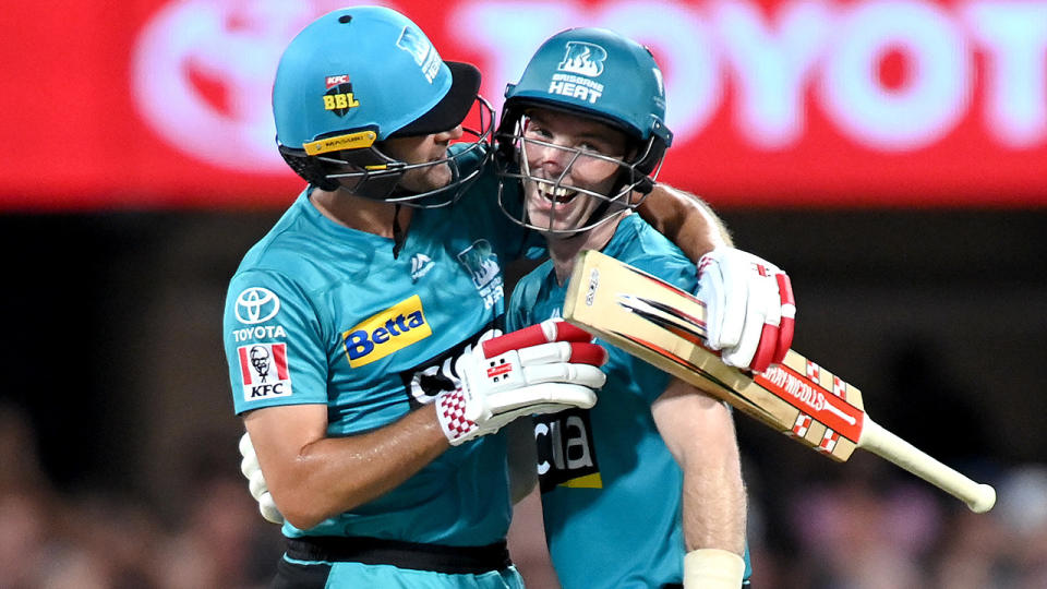 Jimmy Peirson and Joe Burns of the Heat celebrate victory in the Big Bash League Eliminator Final. (Photo by Bradley Kanaris/Getty Images)