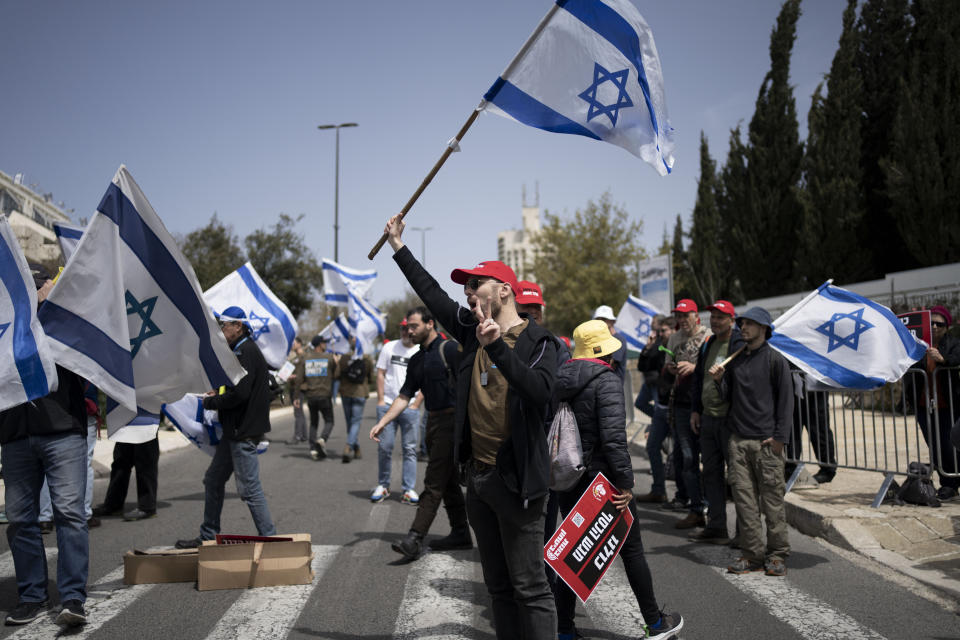 FILE - Members of Brothers and Sisters in Arms and Bonot Alternativa (Women Building an Alternative) protest Israel's exemptions for ultra-Orthodox Jews from mandatory military service, near the Prime Minister's office in Jerusalem, on March 26, 2024. Israel's High Court ruling Thursday to curtail subsidies for ultra-Orthodox men has thrown Prime Minister Benjamin Netanyahu's political future into grave jeopardy. Netanyahu now has until Monday to present the court with a plan to dismantle what the justices called a system that privileges the ultra-Orthodox at the expense of the country's majority. (AP Photo/Maya Alleruzzo, File)