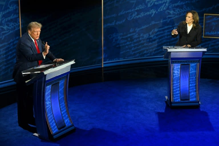 US Vice President and Democratic presidential candidate Kamala Harris (R) and former US President and Republican presidential candidate Donald Trump speak during a presidential debate in Philadelphia, Pennsylvania, on September 10, 2024 (SAUL LOEB)