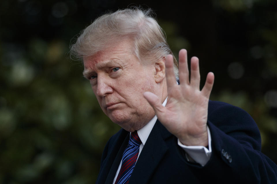 FILE - In this Friday, Feb. 8, 2019, file photo, President Donald Trump waves after arriving on Marine One on the South Lawn of the White House in Washington. Trump is pushing back against criticisms that a leak of his private schedule suggests he is not working hard. (AP Photo/Carolyn Kaster, File)