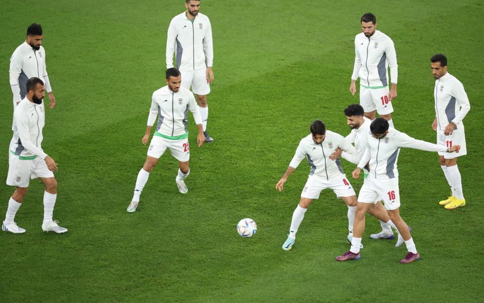 Iran players warm up prior to the FIFA World Cup Qatar 2022 Group B match between IR Iran and USA at Al Thumama Stadium - Alex Grimm/Getty Images