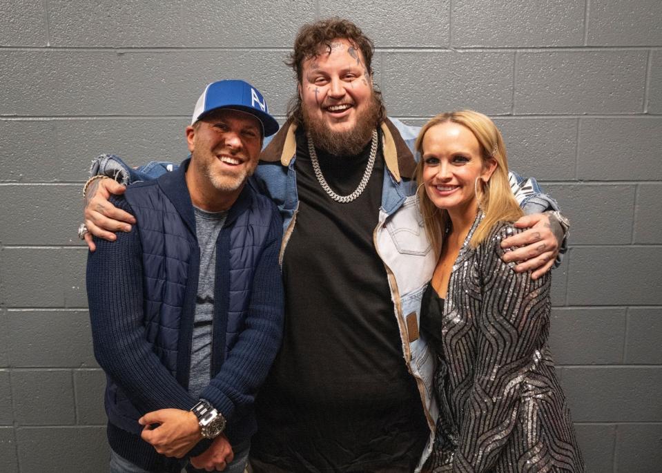 Jelly Roll photographed alongside BMG Nashville president Jon Loba and BMG Nashville executive vice president JoJamie Hahr, Dec. 2022