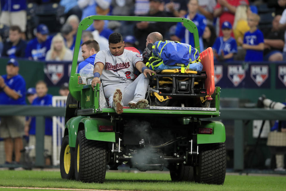 Minnesota Twins third baseman Luis Arraez (2) is taken from the game after an injury during the seventh inning of a baseball game against the Kansas City Royals at Kauffman Stadium in Kansas City, Mo., Saturday, Sept. 28, 2019. (AP Photo/Orlin Wagner)