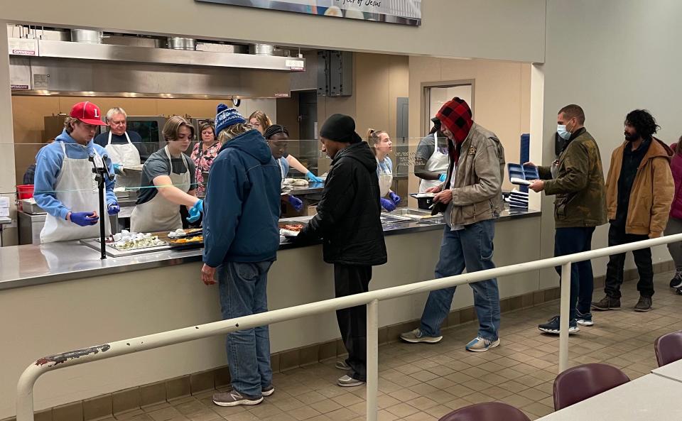 A group of volunteers helps serve breakfast at the Banquet in downtown Sioux Falls. The Banquet serves as many as 200,000 meals annually to those in need at its two facilities.