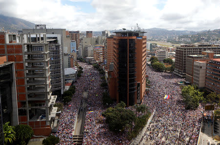 Opposition supporters take part in a rally against Venezuelan President Nicolas Maduro's government and to commemorate the 61st anniversary of the end of the dictatorship of Marcos Perez Jimenez in Caracas, Venezuela January 23, 2019. REUTERS/Adriana Loureiro NO RESALES. NO ARCHIVES.