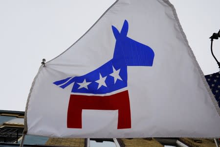 A flag with a logo of the Democratic Party flies over the office of the Racine County Democratic Party in Racine