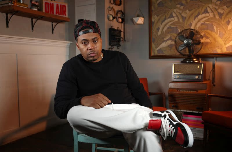 Rapper Nas poses for a photo at Sweet Chick restaurant in Los Angeles