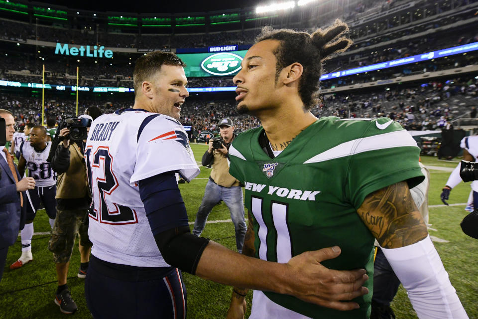 EAST RUTHERFORD, NEW JERSEY - OCTOBER 21: Tom Brady #12 of the New England Patriots shakes hands with Robby Anderson #11 of the New York Jets after his 33-0 win at MetLife Stadium on October 21, 2019 in East Rutherford, New Jersey. (Photo by Steven Ryan/Getty Images)