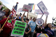 People protest about abortion, Friday, June 24, 2022, outside the Supreme Court in Washington. The Supreme Court has ended constitutional protections for abortion that had been in place nearly 50 years — a decision by its conservative majority to overturn the court's landmark abortion cases. (AP Photo/Steve Helber)