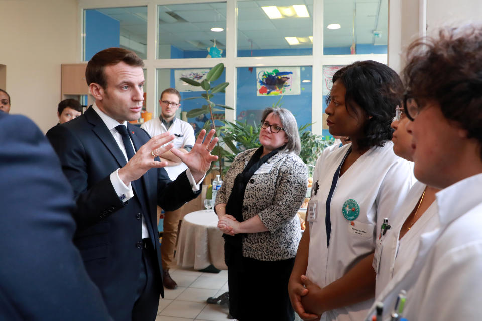 France's President Emmanuel Macron meets staff during a visit to an EHPAD (Housing Establishment for Dependant Elderly People) in the 13th arrondissement of Paris, France amid fear of coronavirus disease (COVID-19) March 6, 2020. Ludovic Marin/Pool via REUTERS