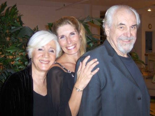 Three people smiling