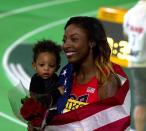 <p>After winning the 100-metre track hurdle and field event at the World Indoor Championships with a personal best of 7.80, American track and field athlete Nia Ali took a break from the field when her son was born in 2015. Ali, however, made a stunning come back in 2016, to defend her gold medal and beat her own record with 7.81 seconds.<br>After winning, Ali took her son for the victory lap. In a twitter post after her win, Ali wrote about how mothers in demanding careers often struggle with ‘Mother Guilt.’ However, she added, it is important to realise that the ‘seeds we are planting for our children’s future are just as important for them and the world they are living in.’<br><em><br>Image credit: By filip bossuyt from Kortrijk, Belgium – 291 nia ali winnares 60mH, CC BY 2.0, https://commons.wikimedia.org/w/index.php?curid=47873500</em> </p>