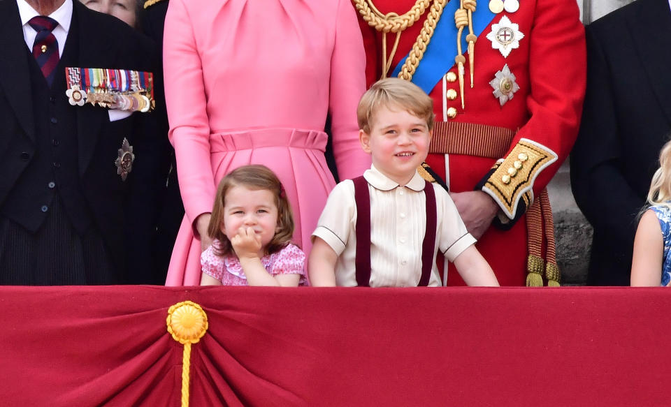 LONDON, ENGLAND - JUNE 17:  Princess Charlotte of Cambridge and Prince George of Cambridge stand on the balcony of Buckingham Palace during the Trooping the Colour parade on June 17, 2017 in London, England.  (Photo by James Devaney/WireImage)