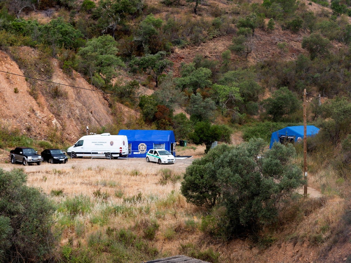 Vehicles and tents of Portugal's investigative Judicial Police are seen at the site of a remote reservoir where a new search for the body of Madeleine McCann took place, in Silves, Portugal (REUTERS)