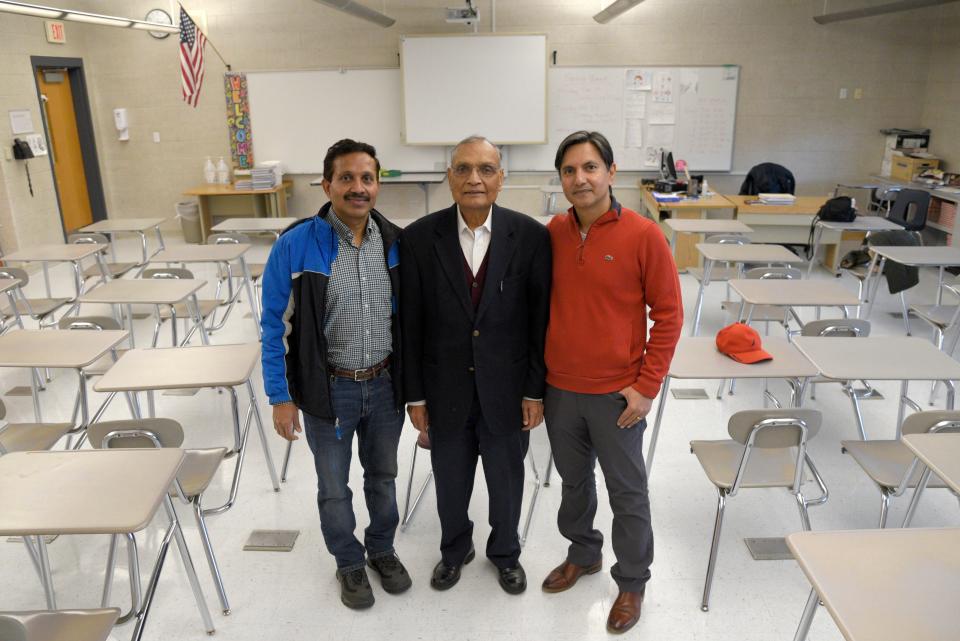 From left: Brij Gupta, Dr. Bishan Agrawal and Raskesh Chandwani on Saturday, December 17, 2022 at Marlboro Memorial Middle School in Marlboro, New Jersey. Agrawal founded the Marlboro Hindi School in 2001, when 5 families met in his basement for lessons. After Gupta’s and Chandwani’s children graduated from the Saturday school, they joined the school’s administration as directors. 