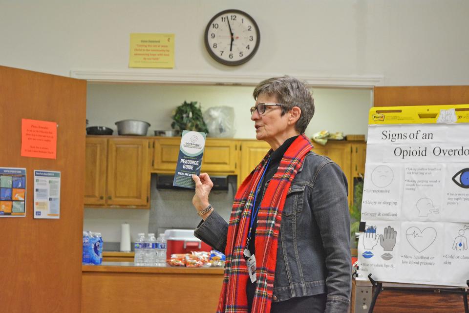 Heather Harlan, health educator with Columbia/Boone County Public Health and Human Services, displays a variety of resources available Thursday for attendees of a Narcan, generic name Naloxone, distribution at St. Luke's United Methodist Church.