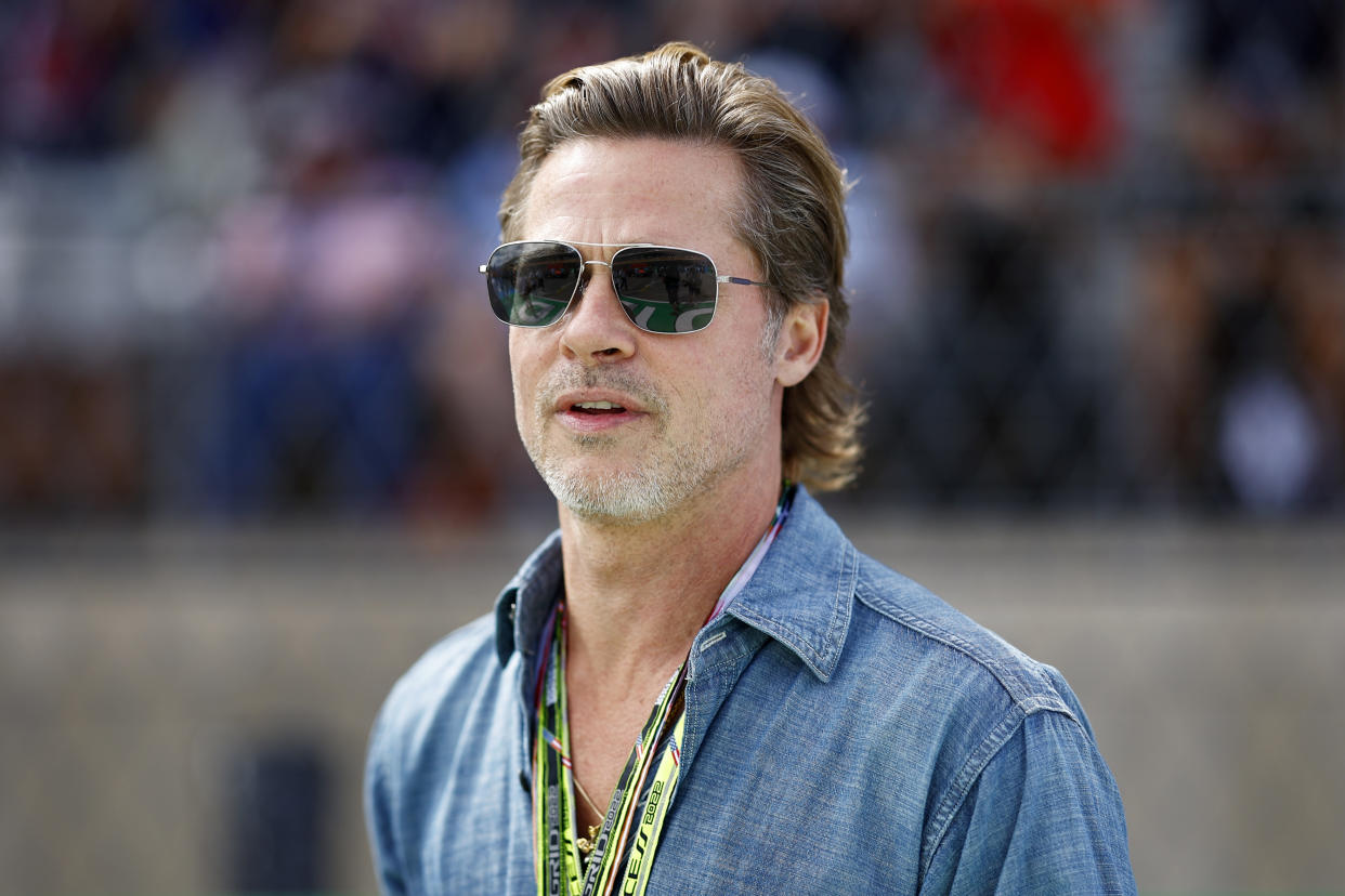 AUSTIN, TEXAS - OCTOBER 23: Brad Pitt looks on from the grid during the F1 Grand Prix of USA at Circuit of The Americas on October 23, 2022 in Austin, Texas. (Photo by Chris Graythen/Getty Images)