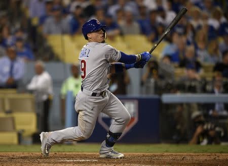 Oct 20, 2016; Los Angeles, CA, USA; Chicago Cubs second baseman Javier Baez (9) doubles in two runs in the eighth inning against the Los Angeles Dodgers in game five of the 2016 NLCS playoff baseball series against the Los Angeles Dodgers at Dodger Stadium. Mandatory Credit: Kelvin Kuo-USA TODAY Sports