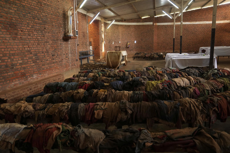 Victims' clothes who were slaughtered as they sought refuge inside and around the Catholic church cover the pews as a memorial to the thousands who were killed during the 1994 genocide, in Nyamata, Rwanda, Friday, April 5, 2024. An estimated 800,000 Tutsis were killed by extremist Hutus in massacres that lasted over 100 days in 1994. Some moderate Hutu who tried to protect members of the Tutsi minority were also targeted. (AP Photo/Brian Inganga)