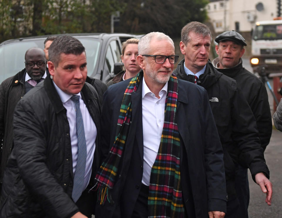 Labour Party leader Jeremy Corbyn (centre) being escorted into Dudley Pensioner Club by police after being heckled, while in Upper Gornal, West Midlands, on the General Election campaign following the launch of his party's manifesto.