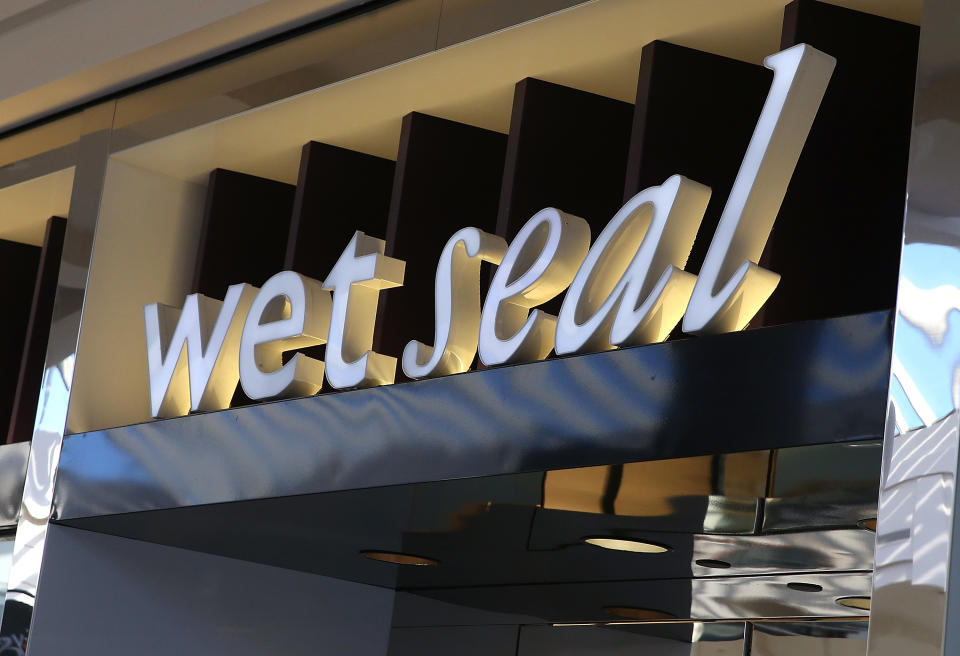 SAN FRANCISCO, CA - JANUARY 07:  The Wet Seal logo is displayed on the exterior of a closed store on January 7, 2015 in San Francisco, California. Wet Seal, a teen clothing retailer, announced that it has closed 338 of its retail stores and will lay off nearly 3,700 employees.  (Photo by Justin Sullivan/Getty Images)