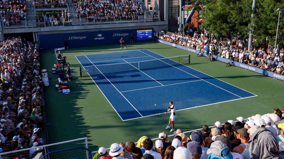 Evans returns a shot against Khachanov. - Jamie Squire/Getty Images