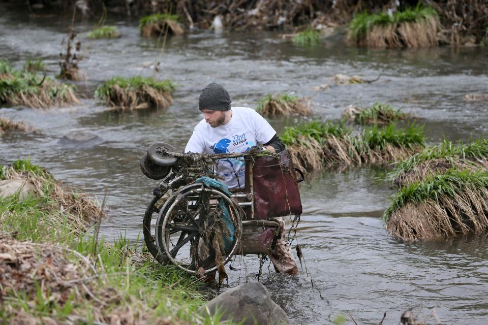 Volunteers remove trash and debris from Lincoln Creek near North 50th and West Congress Street in 2017. The cleanup is part of the Milwaukee Riverkeeper's Adopt-A-River Program for the Milwaukee, Menomonee and Kinnickinnic rivers.