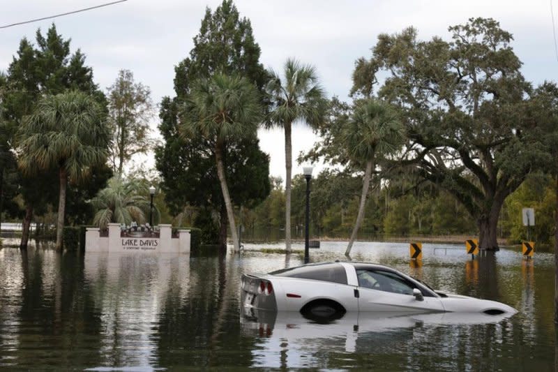 A partially submerged Corvette shows the dangers of localized flooding and climate change after Hurricane Ian made landfall near Orlando, Fla., on Sept. 28, 2022. Photo by Gary Bogdon/EPA-EFE