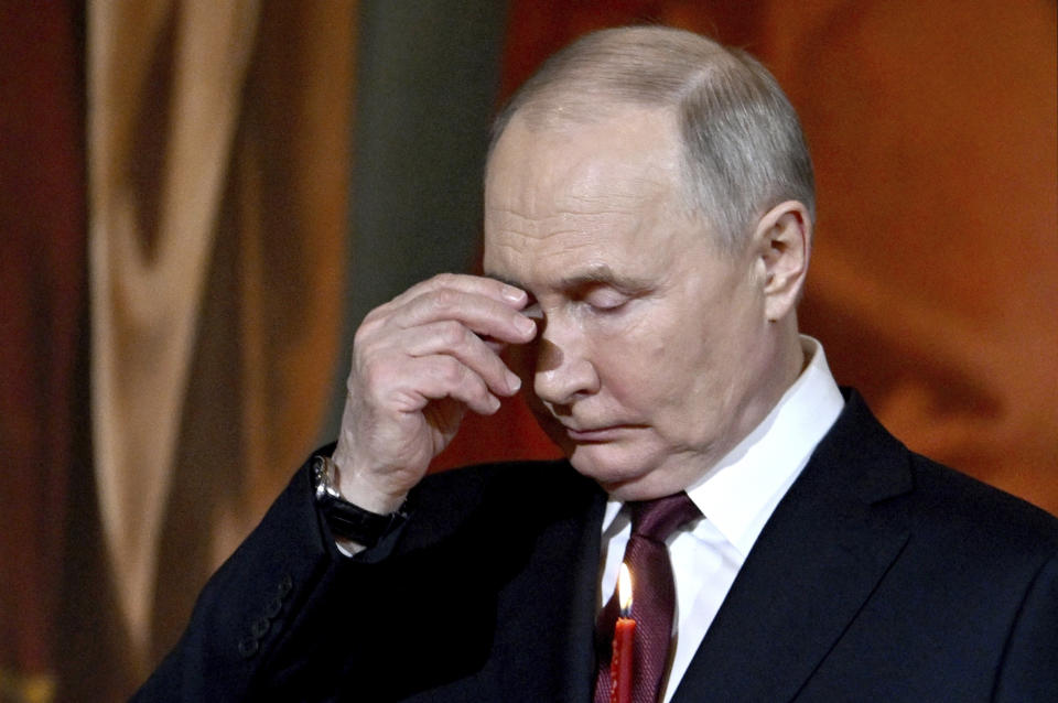 Russian President Vladimir Putin attends the Orthodox Easter service at the Cathedral of Christ the Saviour in Moscow, Russia, Sunday, May 5, 2024. (Pavel Bednyakov, Sputnik, Kremlin Pool Photo via AP)