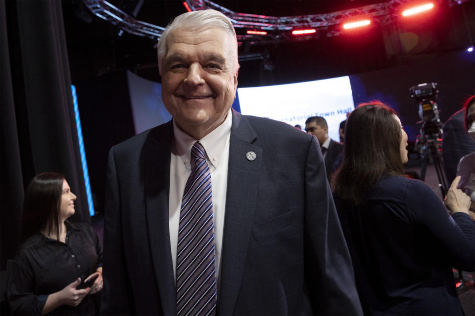 Gov. Steve Sisolak, D-Nev., greets attendees following a debate with Nevada Republican gubernatorial nominee Joe Lombardo during IndyFest at Worre Studios, Sunday, Oct. 2, 2022, in Las Vegas. (AP Photo/Ellen Schmidt)