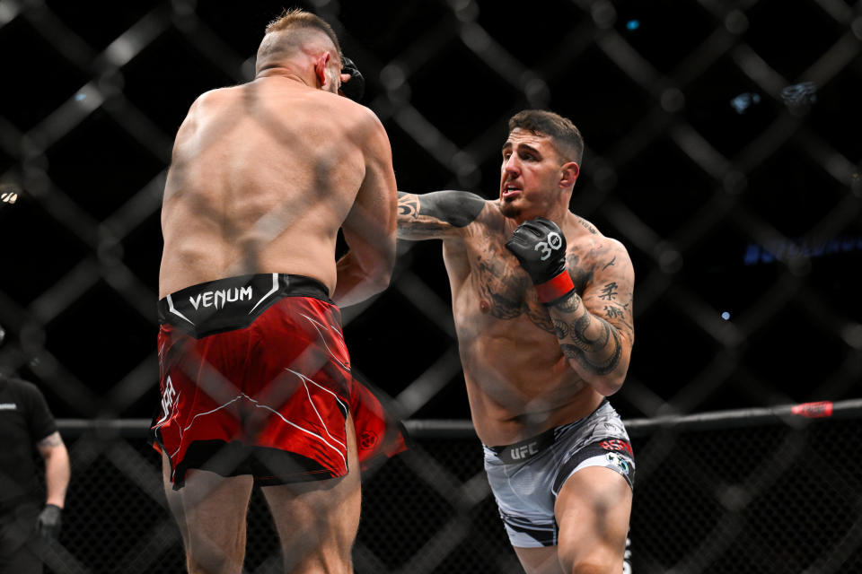 Jul 22, 2023; London, UNITED KINGDOM; Tom Aspinall (red gloves) fights Marcin Tybura (blue gloves) during UFC Fight Night at O2 Arena. Mandatory Credit: Per Haljestam-USA TODAY Sports