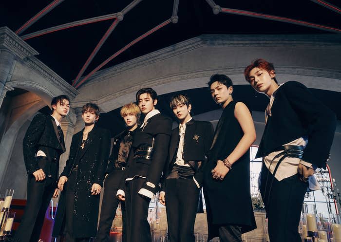 K-pop group Enhypen posing for their album Dark Blood by standing together