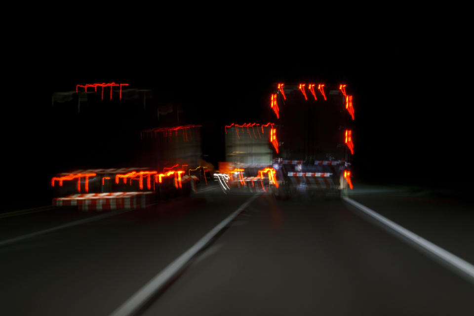 In this April 4, 2020, photo, trucks travel on westbound Interstate 70 near Terre Haute, Ind., before dawn. During the coronavirus outbreak, truckers continue work night and day so the supply chain is not disrupted. (AP Photo/Carolyn Kaster)